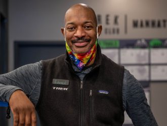 Trek retail employee standing inside shop.