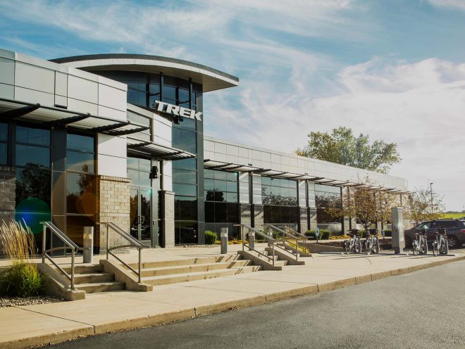 Exterior view of Trek Headquarters in Waterloo, Wisconsin, on a sunny day.