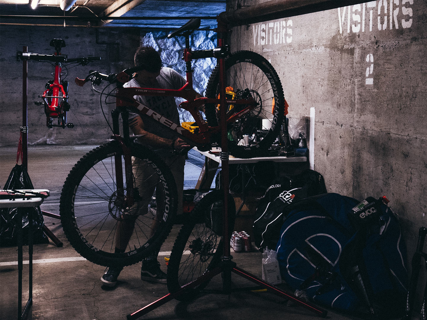 mechanic works on bike in shop