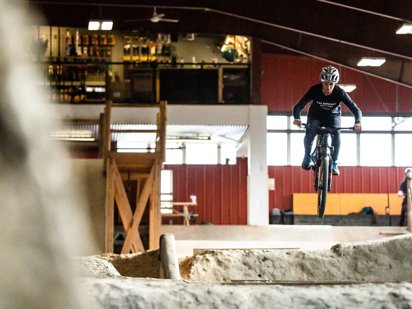 Christina Chappetta jumping towards the camera on dirt jump