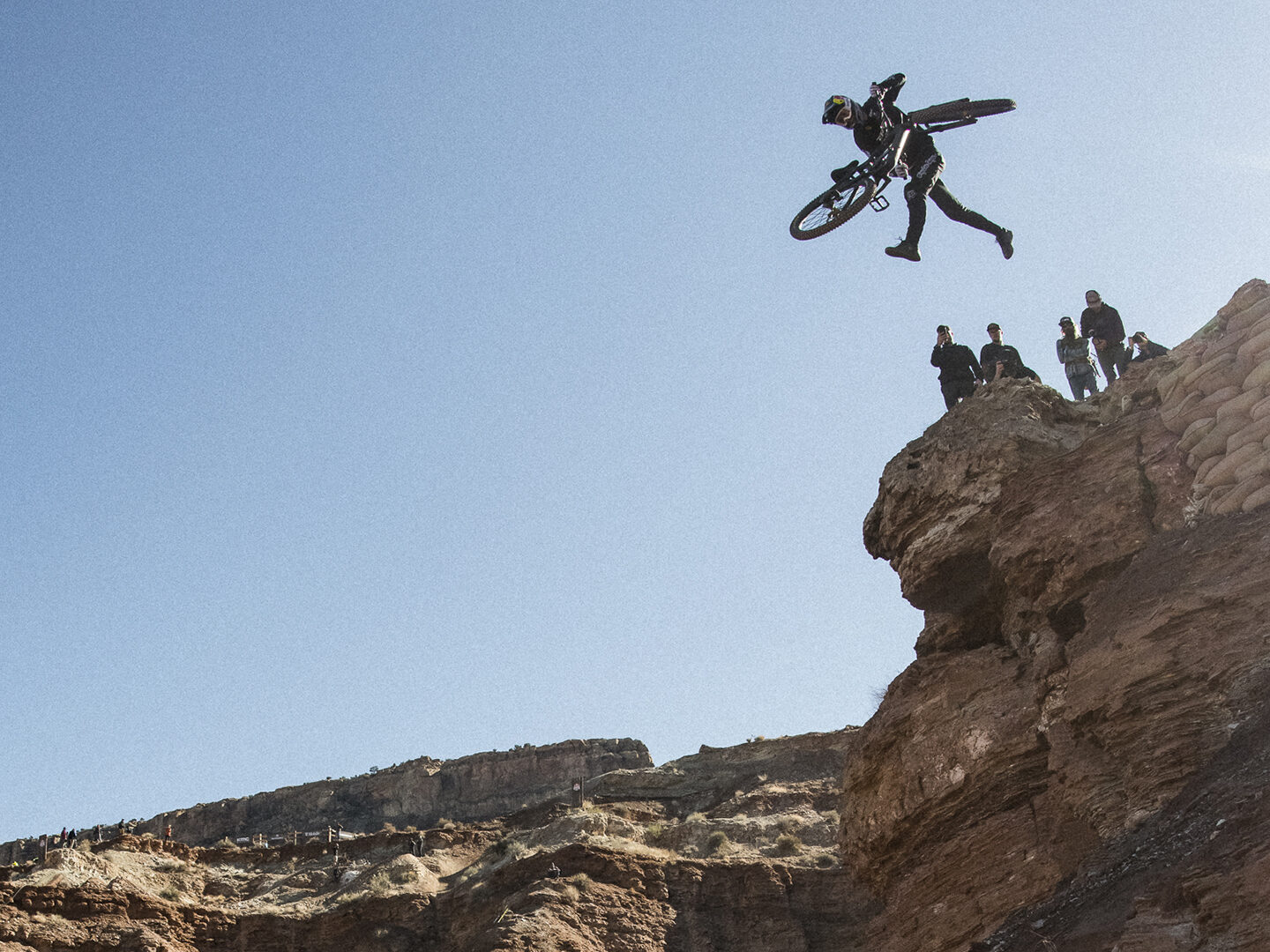 Brandon Semenuk throwing a huge tailwhip off of a cliff at Red Bull Rampage.