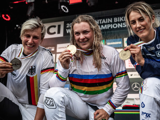 Trek Factory Racing's Vali Höll holds up her medal at the UCI World Cup championships