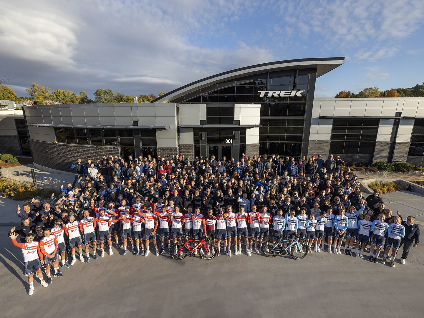 The Trek-Segafredo race teams and Trek employees standing in front of Trek Headquarters in Waterloo, WI.