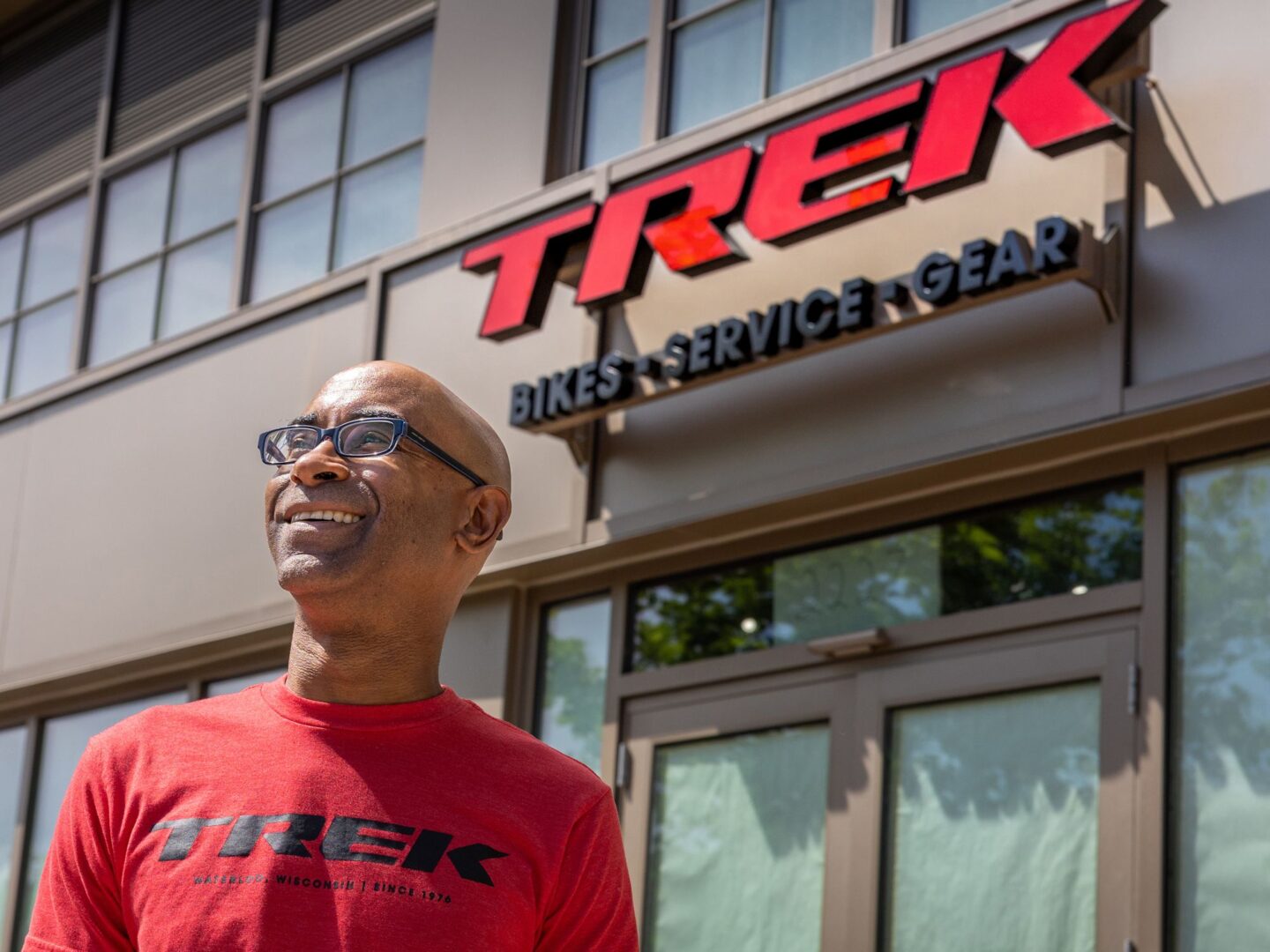 Store Manager Keith Jackson smiling in front of the Skyland Development Trek store.