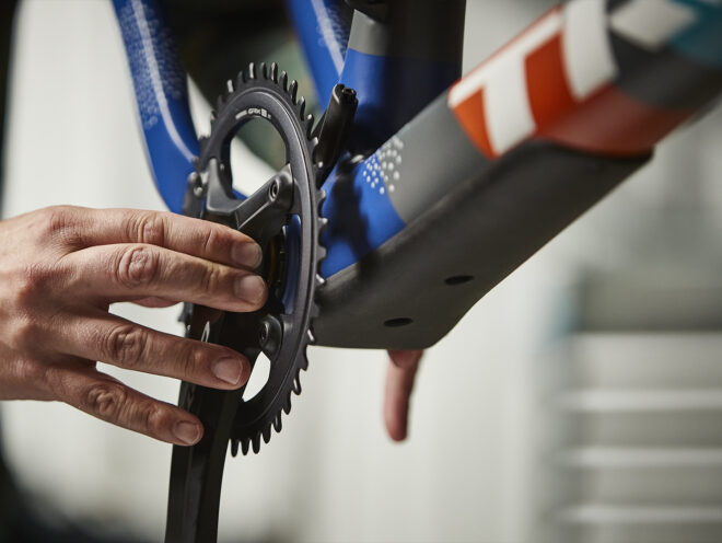 A mechanic installs the Shimano GRX crankset on the United in Gravel Checkpoint SLR.