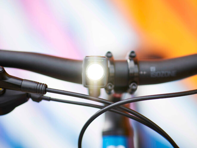 A front bike light on a hybrid bike.