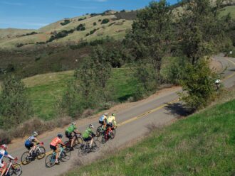 A group of cyclists climb up Mount Diablo.